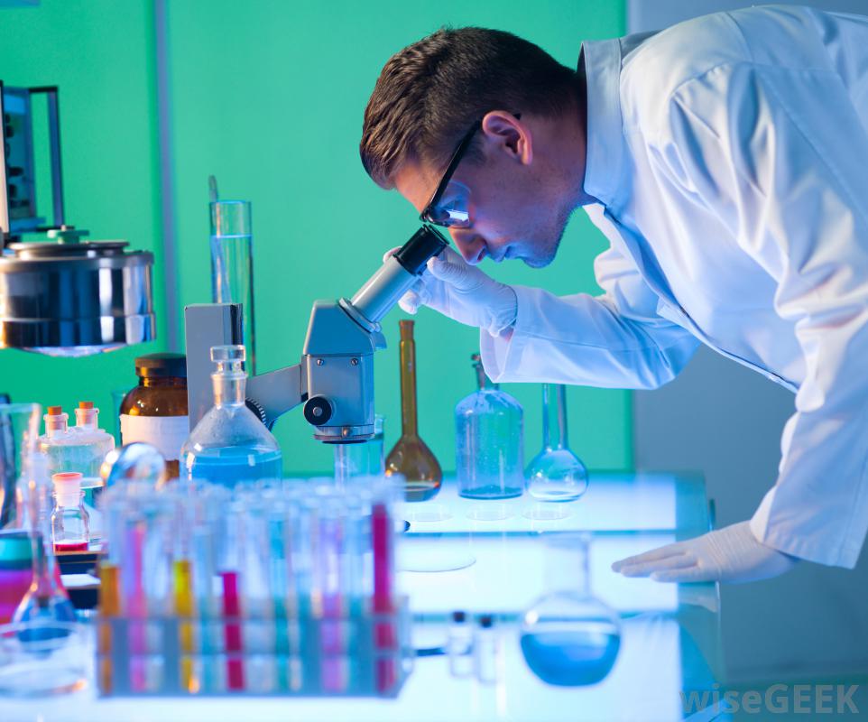 male-in-lab-looking-through-microscope.jpg